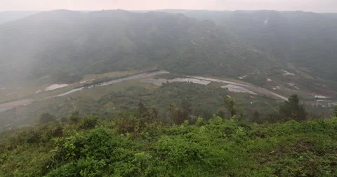 Soft mist drifts through the lush hills of Meghalaya Stock Footage 335668336