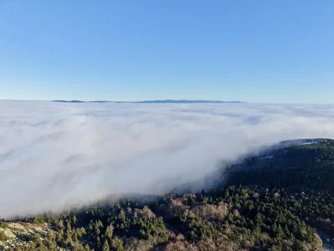 Soft Morning Mist Envelops Shoreline Forests With Distant Island Outlines And Stock Photos