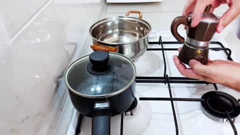 Soft Morning Ritual: Preparing Coffee Beside Stainless Steel Cookware Vidéo 314433016