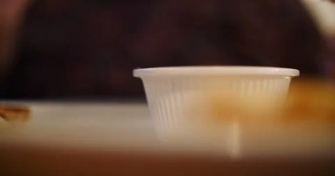 Soft naan bread served with creamy dipping sauce in a restaurant Stock Footage 281705116