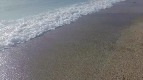 Soft Ocean Wave Foam Lapping on Sandy Beach Shore Stock Footage 326305569