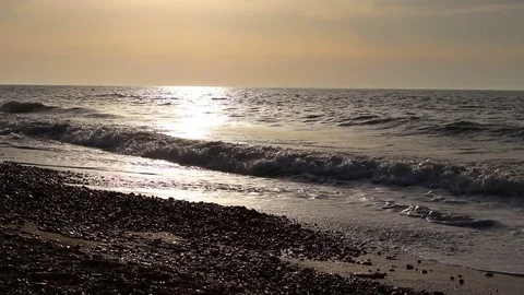 Soft ocean waves at beach at sunset with sound. Stock Footage 126141275