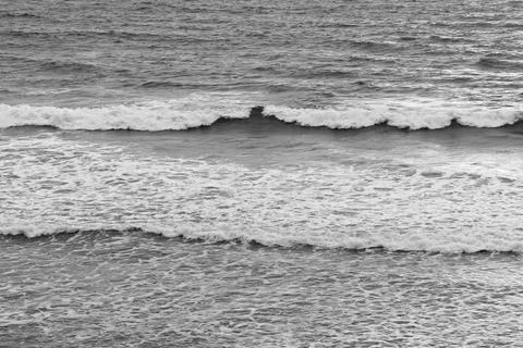 Soft ocean waves roll toward the shoreline Stock Photos