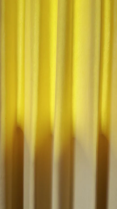 Soft Orange Curtain with Warm Yellow Light and Draped Texture Stock Footage 343626159