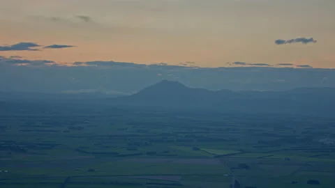 Soft orange sky sunset over farm fields Stock Footage 155447124