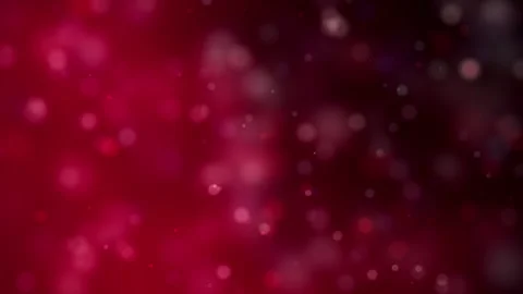 Soft, out-of-focus red bokeh lights drift across a dark background, creating a Stock Footage 344241451