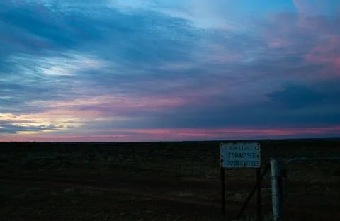 Soft Outback Dusk Behind Warning Sign Stock Photos