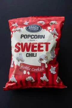 Soft package of kettle cooked popcorn with sweet chili taste. Stock Photos