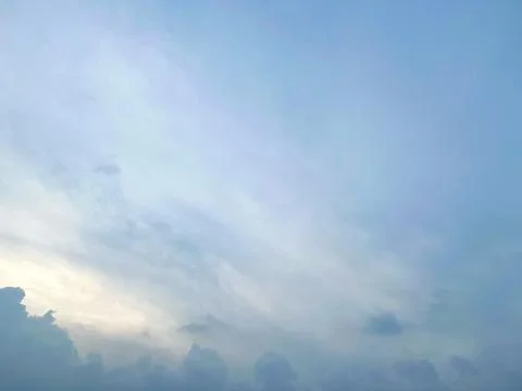 Soft pastel blue sky with wispy white clouds Fotos de archivo