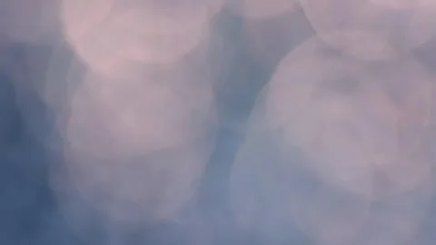 Soft pastel bokeh drifting over a light abstract background for wedding des.. Stock Footage 340034582