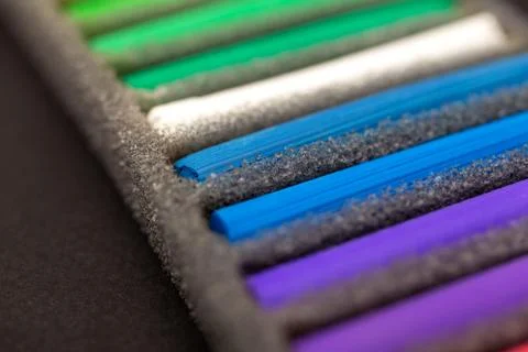 Soft pastel chalks set close up macro, black background Stock Photos