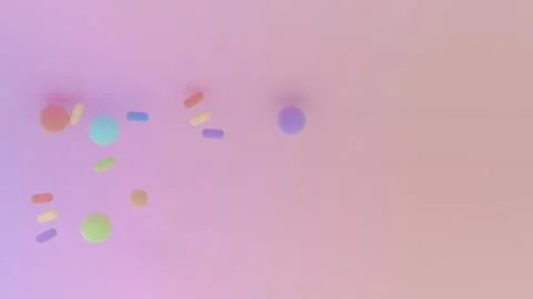 Soft pastel composition with scattered capsules and spheres over a wide pin.. Illustrazione stock