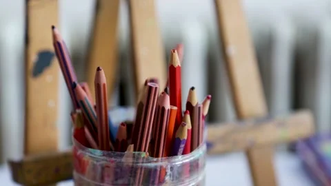 Soft pastel crayons in front of an easel Stock Footage 154313771
