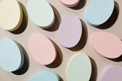 Soft pastel Easter eggs arranged in a pleasing pattern with dramatic shadows Stock Photos