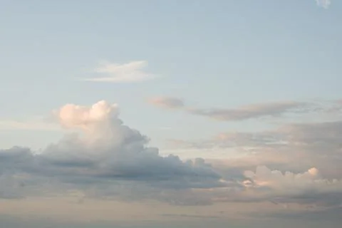 Soft pastel evening clouds at twilight Stock Photos