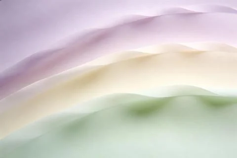 Soft pastel fabric waves create a serene and abstract background with gentl.. Stock Photos