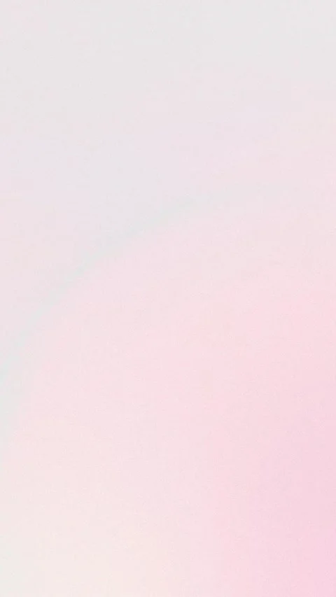 Soft pastel gradient background with pink and white hues, seamless loop. 4K. Stockbeeldmateriaal 309956907