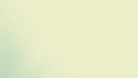 Soft pastel gradient with pale yellow and green hues creates a smooth, seamless Stockbeeldmateriaal 309700699