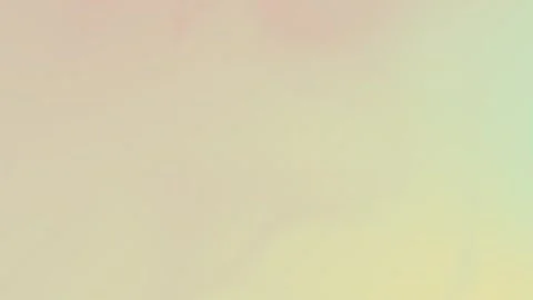 Soft pastel gradient with pale yellow and muted green hues. Seamless loop Stock Footage 309956873