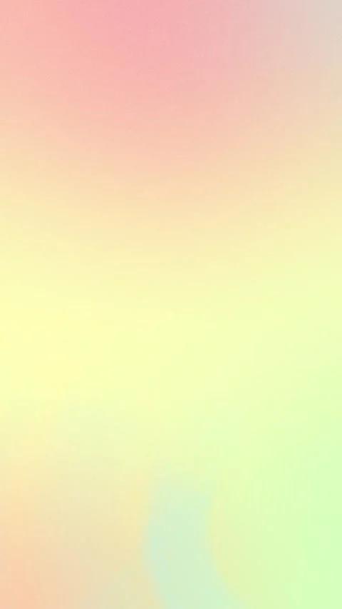 Soft pastel gradient with pink, yellow, and green hues. Seamless loop Stockbeeldmateriaal 309856120