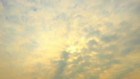 Soft, Pastel Sky with Sunlit Cloudscape at Dawn or Dusk Stock Footage 311586123