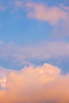 Soft Pastel Sunset Clouds in Blue Sky 스톡 사진