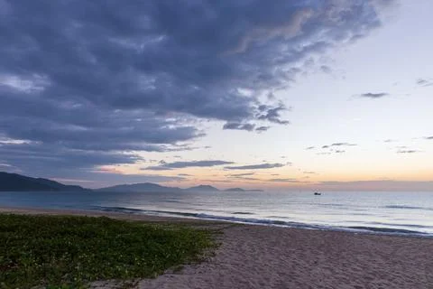 Soft pastel sunset over a tranquil beach seascape with gentle waves, Cam Ra.. Stock Photos