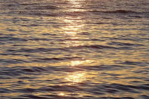 Soft pattern of water waves at sunrise Stock Photos