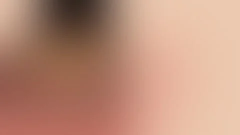 Soft peach and brown blurred gradient with a subtle noise texture. Seamless loop Stock Footage 309955584