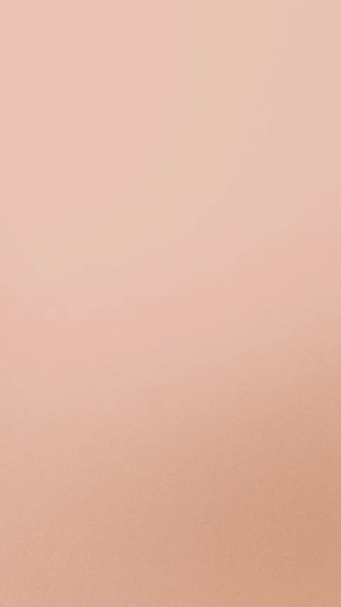 Soft peach gradient texture with subtle grain. Seamless loop background. 4K. Stockbeeldmateriaal 309956447