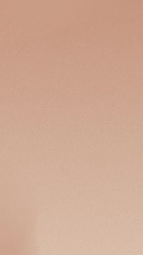 Soft peach seamless loop background with smooth gradient and grainy texture. 4K Vídeo Stock 309856230