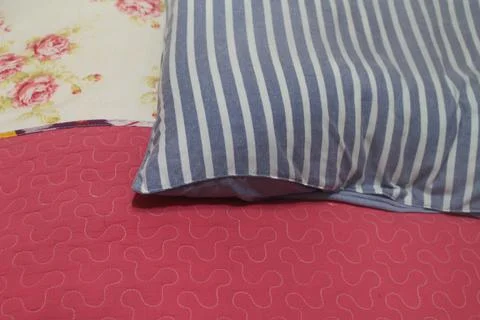 Soft pillows on comfortable bed, top view Stock Photos