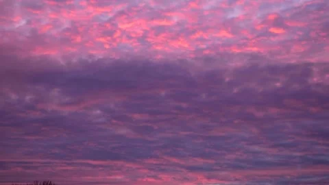 Soft Pink and Violet Cloudy Evening Sky Background With Dramatic Texture Stock Footage 324935730