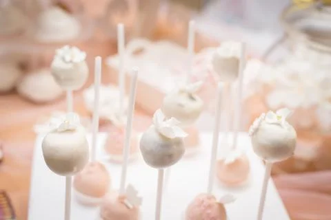 Soft pink cake pops on the background of the candy bar Stock Photos