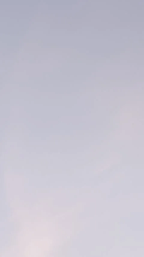 Soft Pink Cloud Streak in Muted Evening Sky Video stock 344717340