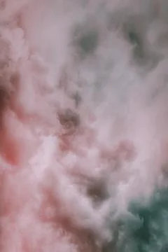 Soft pink cloudy pattern against the blue sky Stock Photos