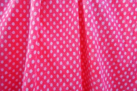 Soft pink fabric texture with delicate white dot details Stock Photos