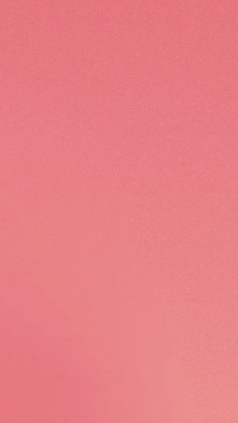 Soft pink gradient background with fine grain texture. Seamless loop for 4K Stock Footage 310143621