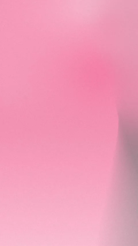 Soft pink gradient background with subtle lighting, forming a smooth seamless Stock Footage 309956431