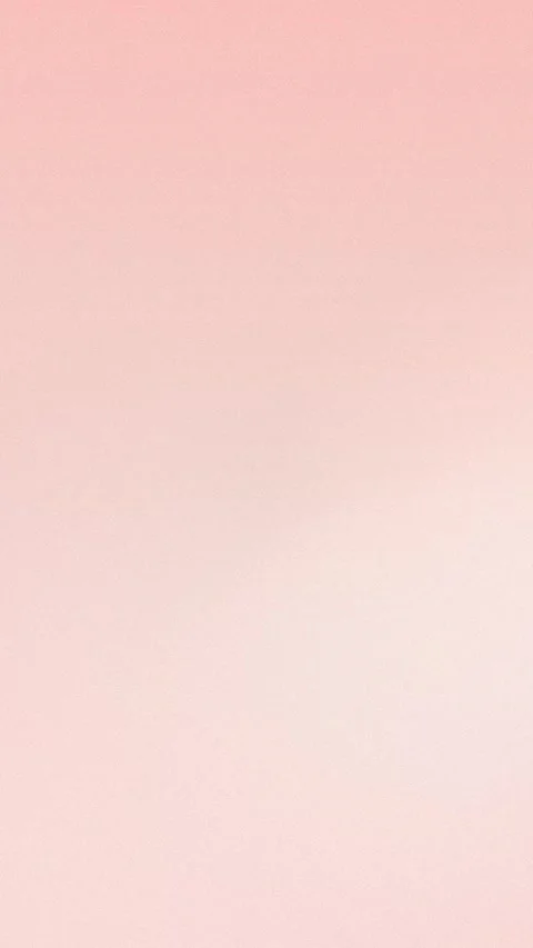 Soft pink gradient with grainy texture. Seamless loop background. 4K. Stock Footage 309957006