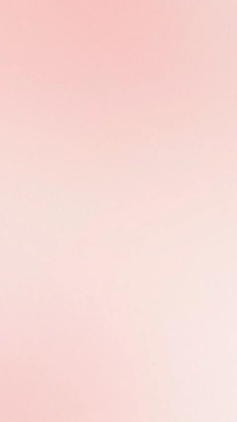 Soft pink grainy gradient background creating a serene and seamless loop. 4K Vidéo 309856116