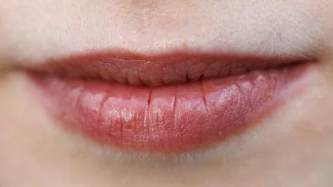 Soft pink lips with subtle texture and natural moisture Stock Photos