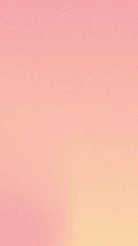 Soft pink to orange gradient with grainy texture. Seamless loop background. 4K. Stockbeeldmateriaal 309856237