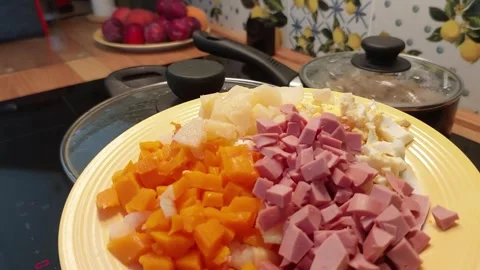 Soft Prep Glow: Chopped Ingredients Await a Warm Kitchen Ritual 스톡 동영상 314100168