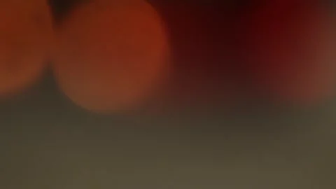 Soft Red and Orange Abstract Bokeh Circles on Dark Background Stock Footage 325419445