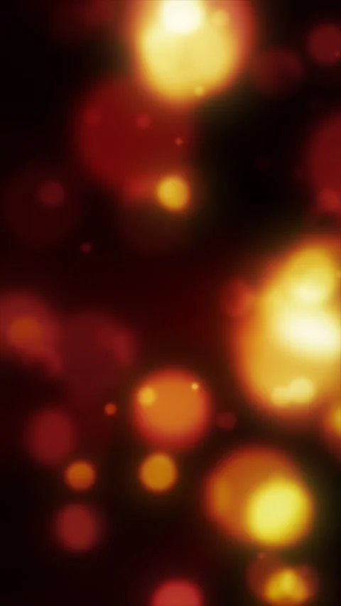 Soft red and orange glowing circles create a warm defocused bokeh backgroun.. Stock Footage 342830059