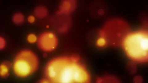 Soft red and orange glowing circles create a warm defocused bokeh background Stock Footage 344904724