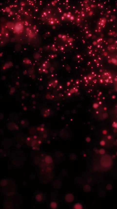 Soft red bokeh lights and floating glitter particles on a dark background, .. Stock Footage 328706286