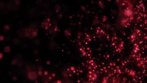 Soft red bokeh lights and floating glitter particles on a dark background Stock Footage 329997661