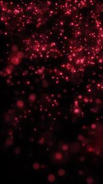 Soft red bokeh lights and floating glitter particles on a dark background, .. Stock Illustration